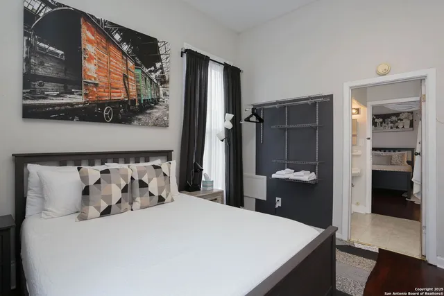 a bathroom with a toilet sink and shower curtain