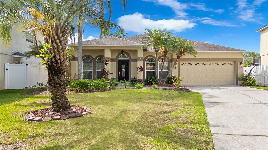 1319 Castleport Road Winter Garden, FL 34787 - Photo 1 of 1 a front view of a house with garden