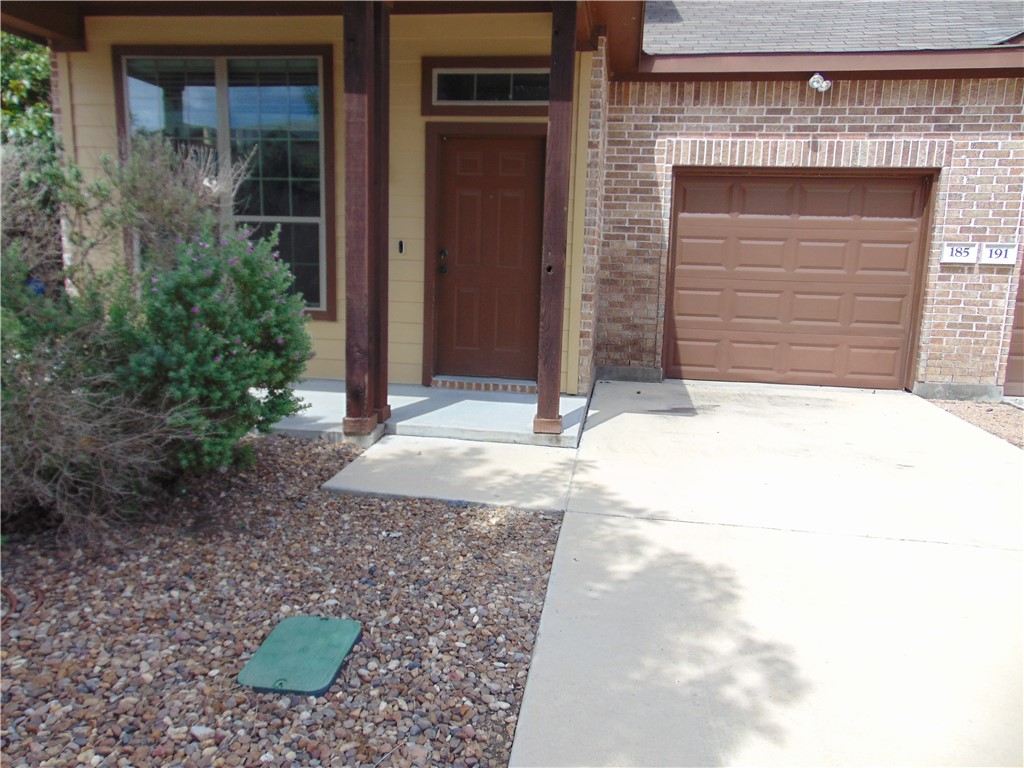 Undisclosed Address Kyle, TX 78640 - Photo 2 of 11 a front view of a house with a yard