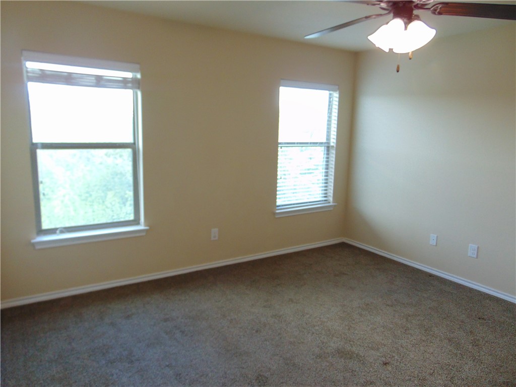 Undisclosed Address Kyle, TX 78640 - Photo 7 of 11 an empty room that has a window