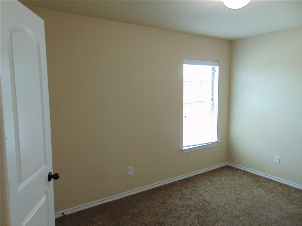 Undisclosed Address Kyle, TX 78640 - Photo 9 of 11 an empty room with a window