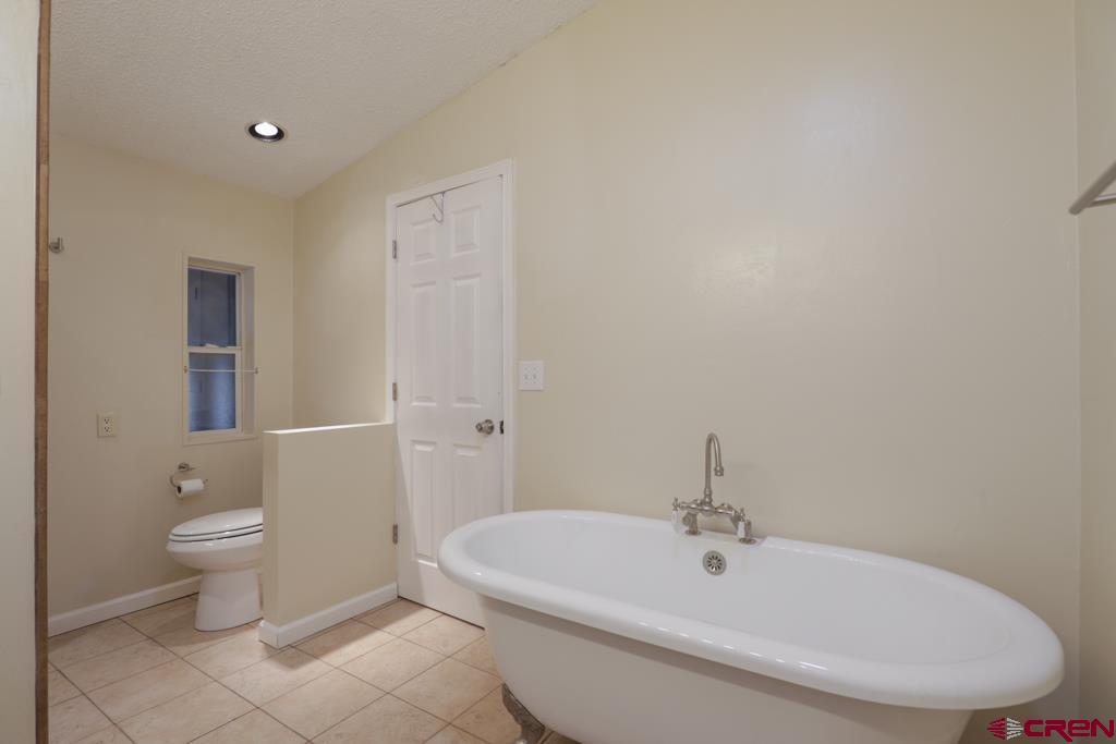 22 Huckleberry Lane Durango, CO 81301 - Photo 13 of 24 a bathroom with a sink a toilet and bathtub