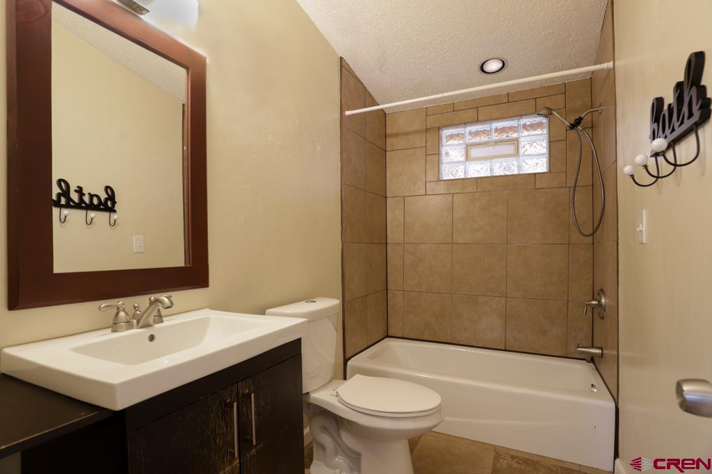 22 Huckleberry Lane Durango, CO 81301 - Photo 15 of 24 a bathroom with a sink toilet and shower