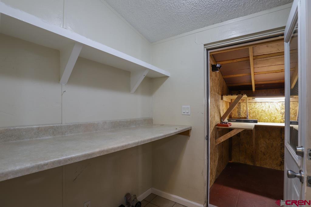 22 Huckleberry Lane Durango, CO 81301 - Photo 18 of 24 a utility room with a sink