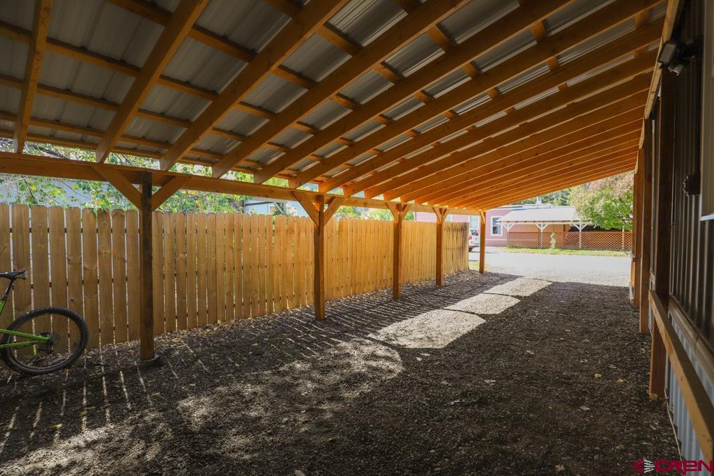 22 Huckleberry Lane Durango, CO 81301 - Photo 19 of 24 a view of a backyard with table and chairs
