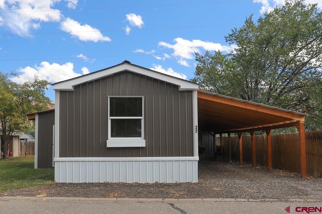 22 Huckleberry Lane Durango, CO 81301 - Photo 3 of 24 a house with trees in the background