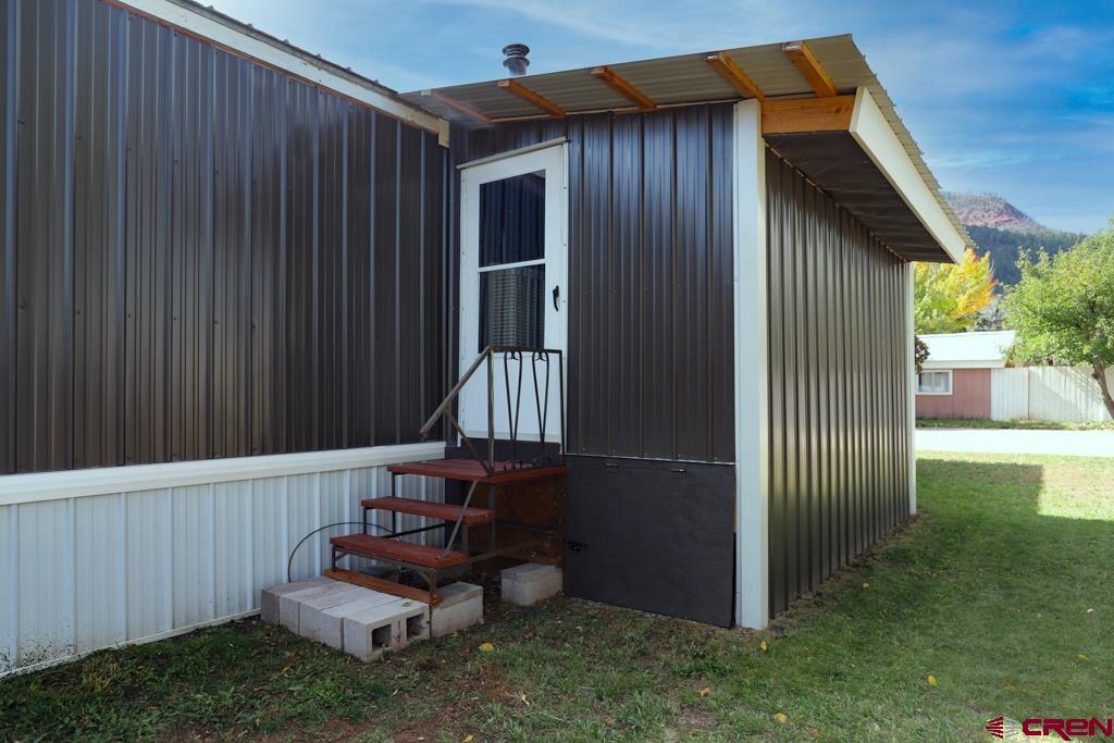 22 Huckleberry Lane Durango, CO 81301 - Photo 24 of 24 a view of a backyard with wooden fence and a bench