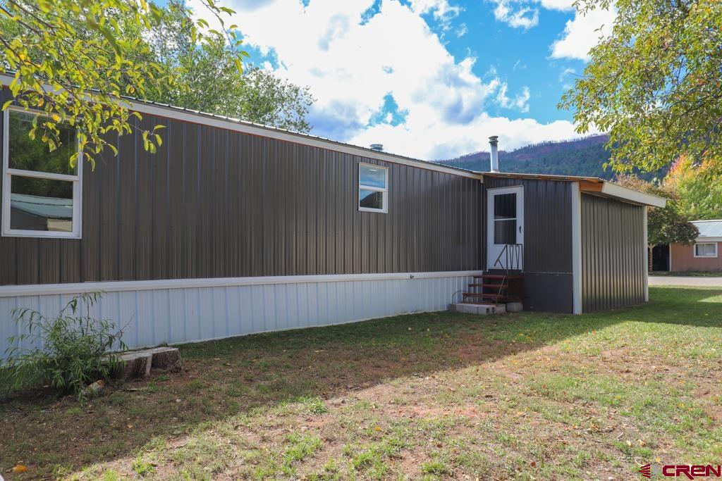 22 Huckleberry Lane Durango, CO 81301 - Photo 4 of 24 a view of a house with a yard
