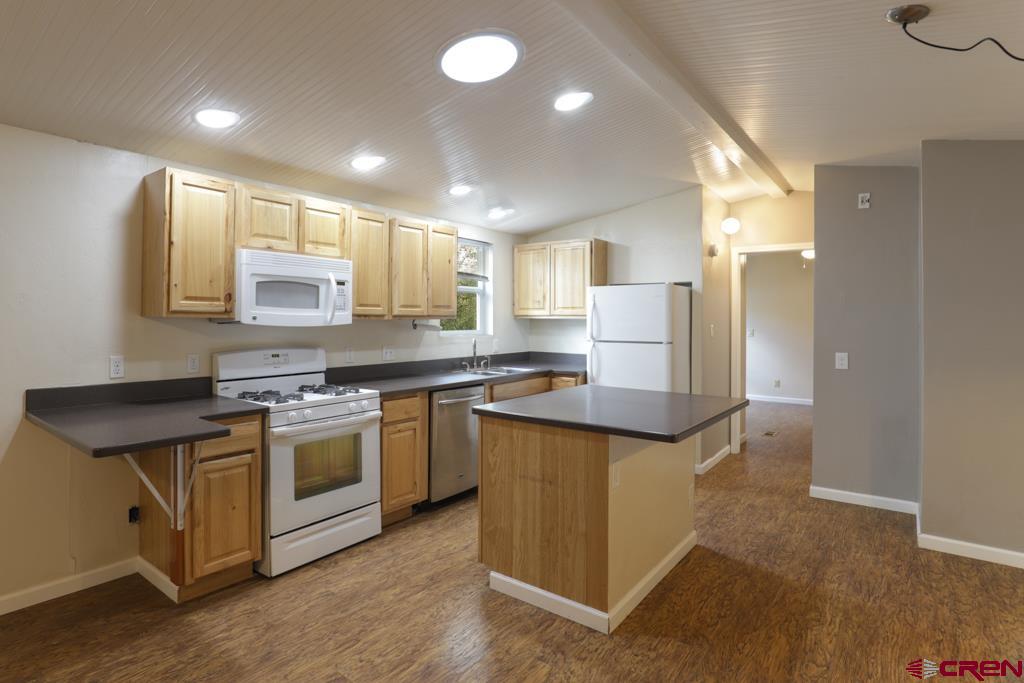 22 Huckleberry Lane Durango, CO 81301 - Photo 5 of 24 a kitchen with stainless steel appliances granite countertop a stove a sink and a refrigerator