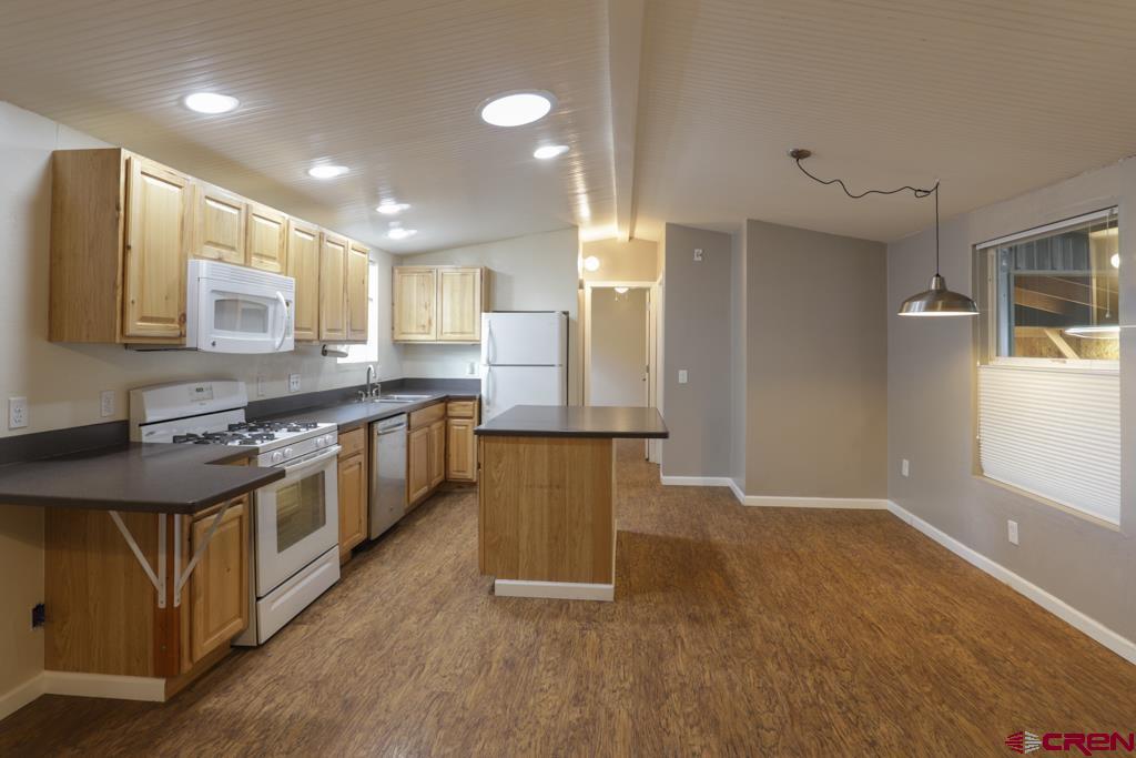 22 Huckleberry Lane Durango, CO 81301 - Photo 6 of 24 a kitchen with stainless steel appliances granite countertop a sink stove and refrigerator