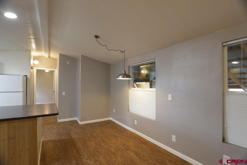 22 Huckleberry Lane Durango, CO 81301 - Photo 8 of 24 wooden floor in an empty room with a window