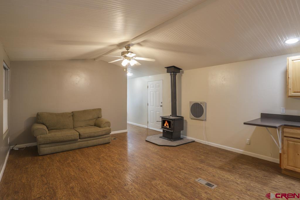 22 Huckleberry Lane Durango, CO 81301 - Photo 9 of 24 a living room with furniture and a chandelier