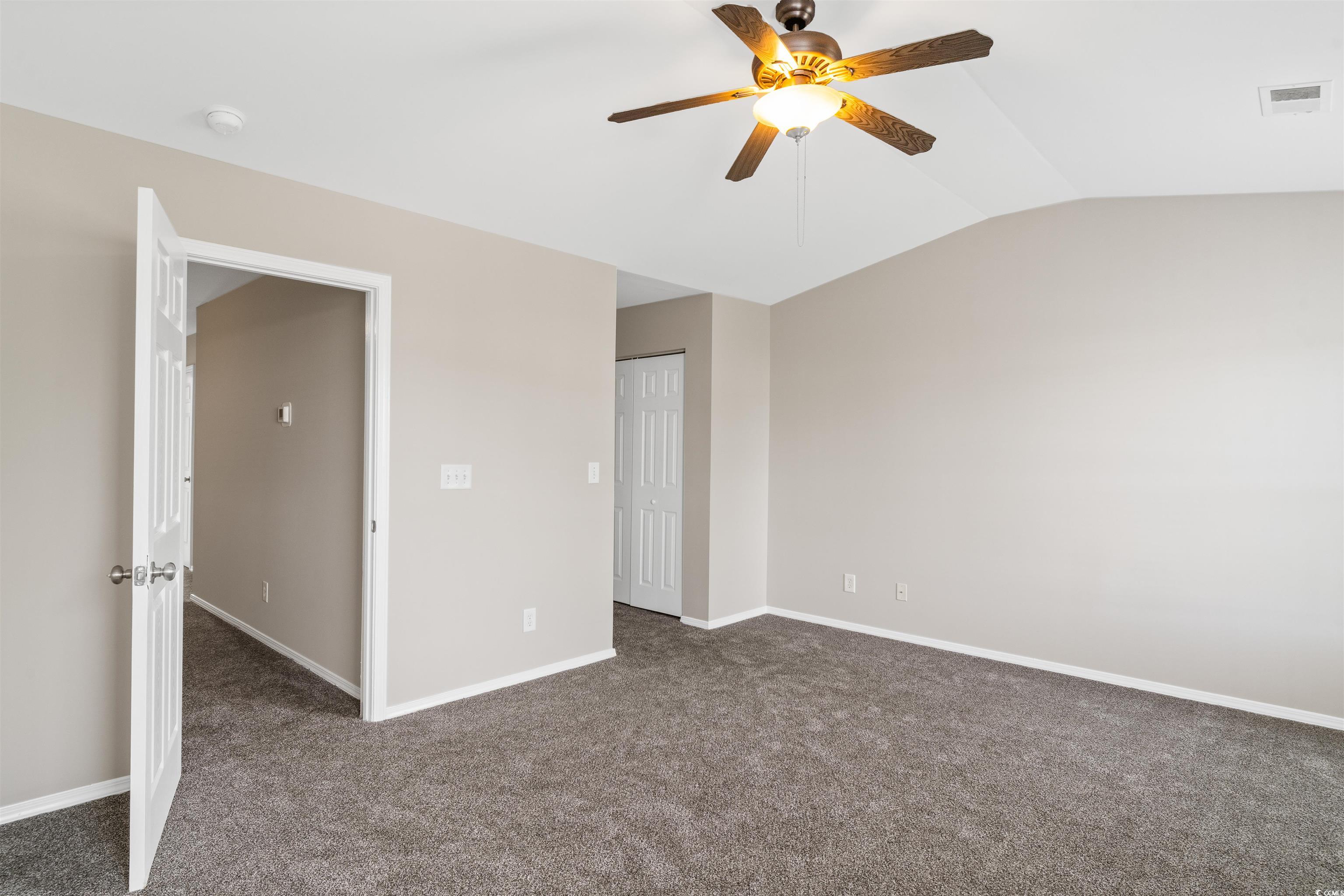 350 Kiskadee Loop, Unit B Conway, SC 29526 - Photo 13 of 40 Carpeted spare room featuring vaulted ceiling and