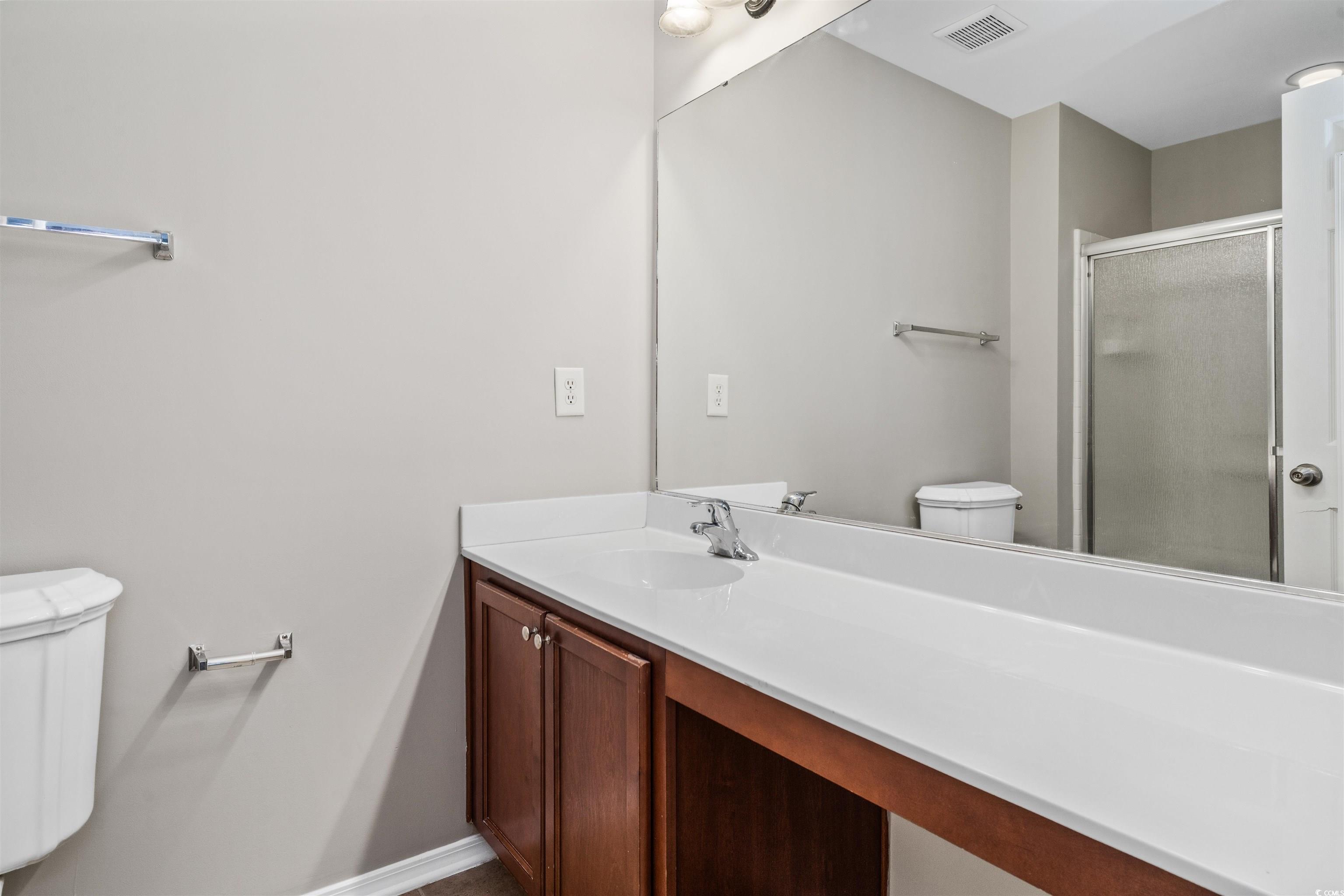 350 Kiskadee Loop, Unit B Conway, SC 29526 - Photo 16 of 40 Bathroom featuring vanity, a shower with shower do