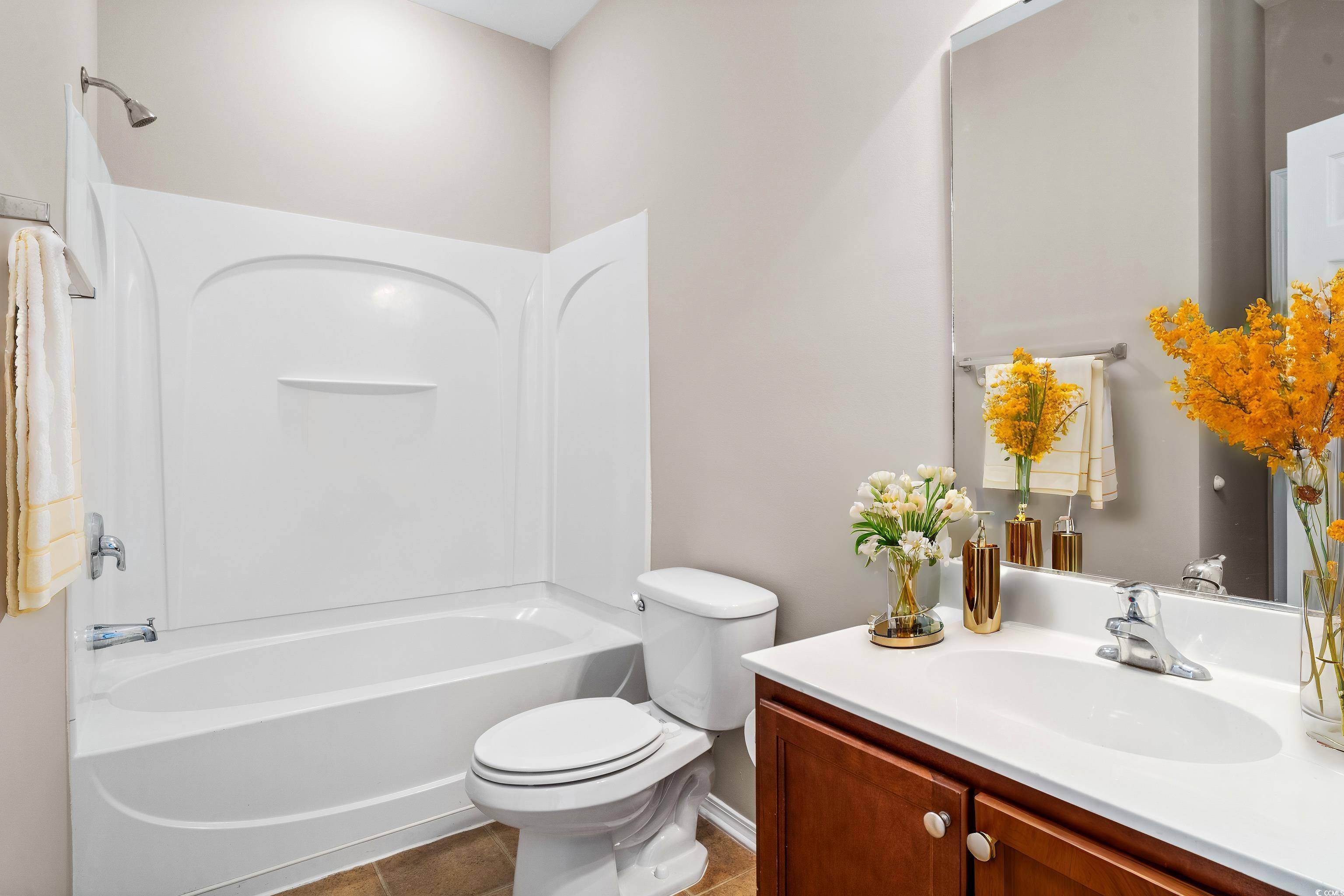 350 Kiskadee Loop, Unit B Conway, SC 29526 - Photo 23 of 40 Full bathroom with vanity, toilet, tile patterned