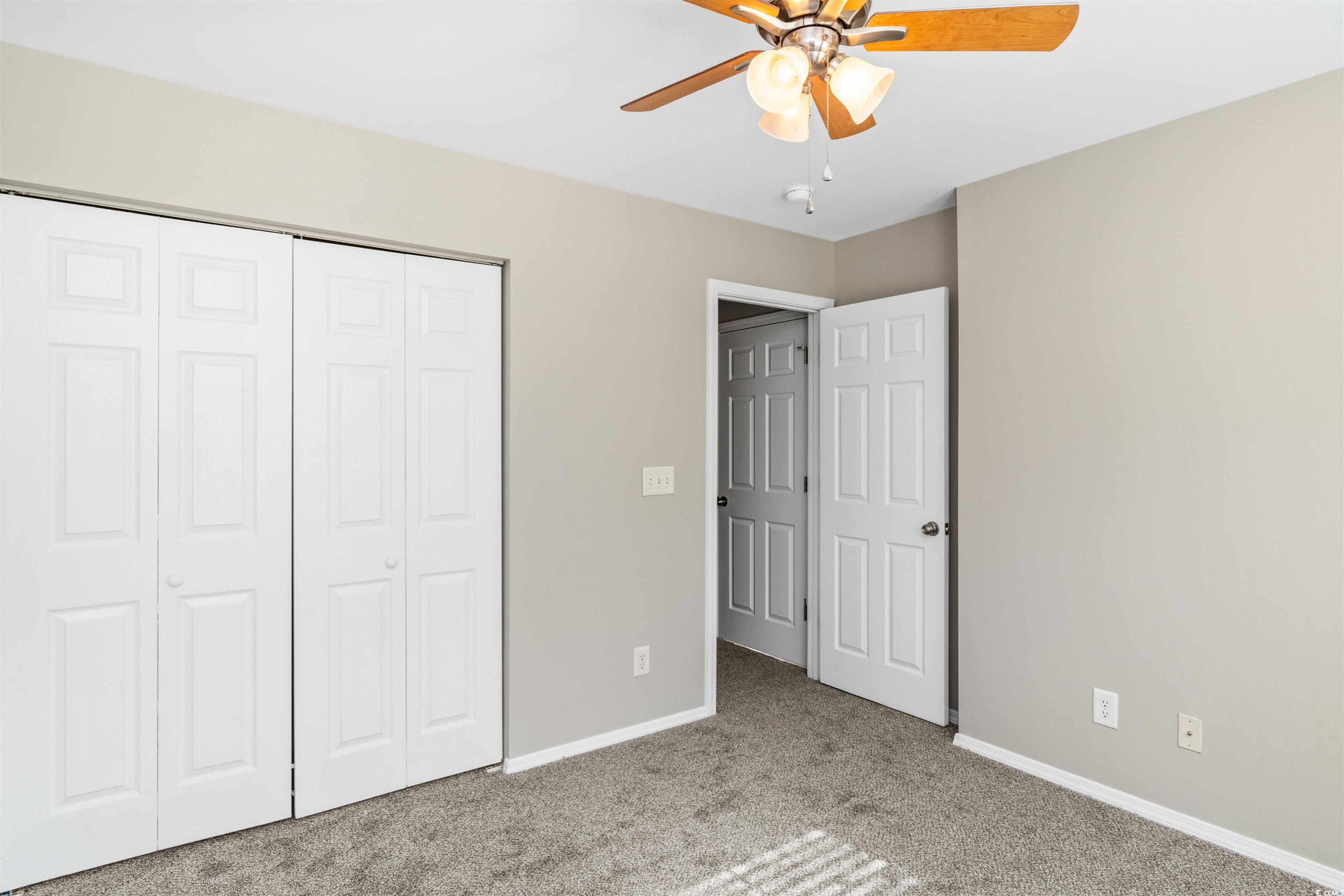 350 Kiskadee Loop, Unit B Conway, SC 29526 - Photo 28 of 40 Unfurnished bedroom featuring a closet, light carp