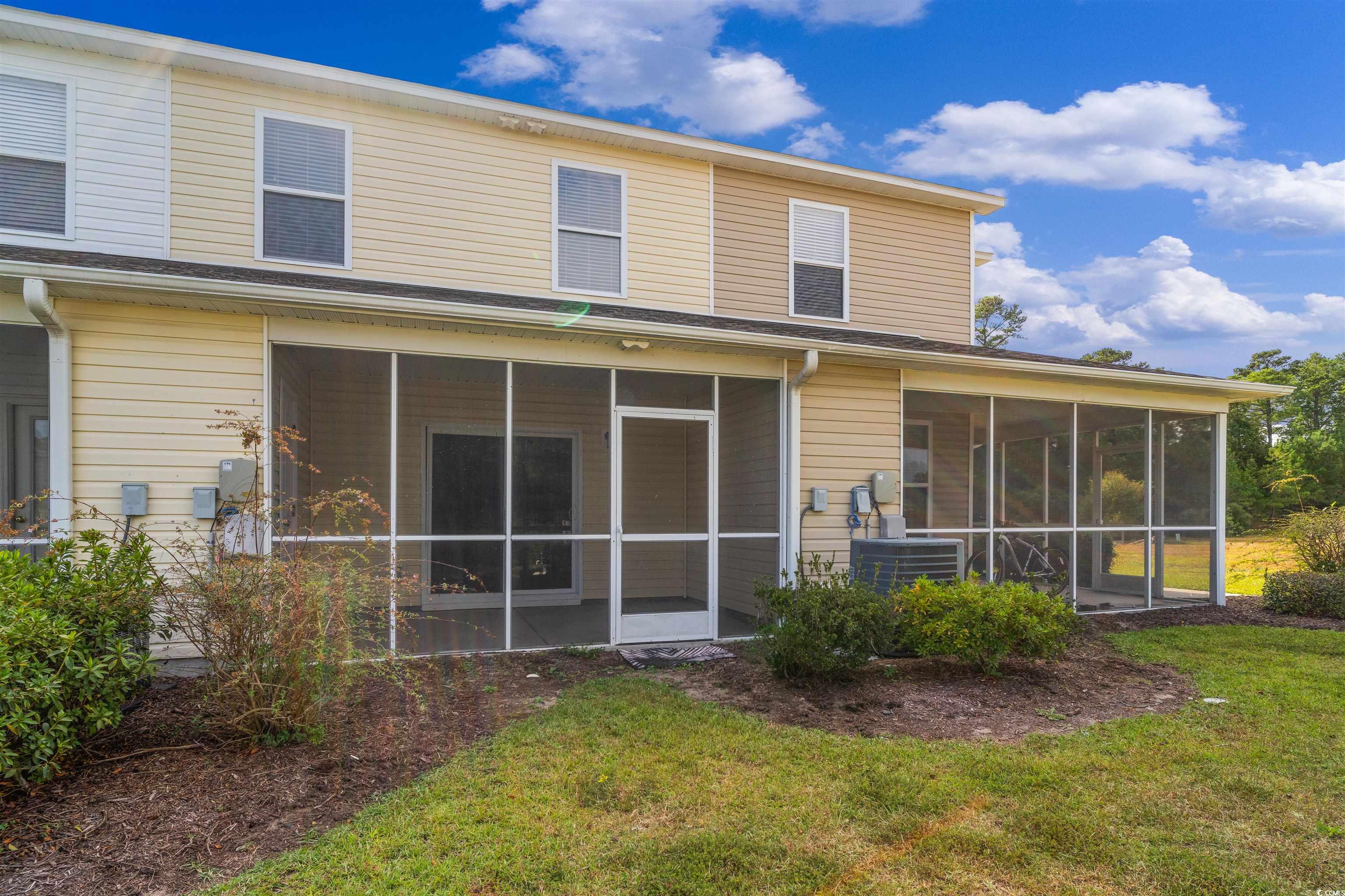 350 Kiskadee Loop, Unit B Conway, SC 29526 - Photo 32 of 40 Back of property featuring a yard, a sunroom, and