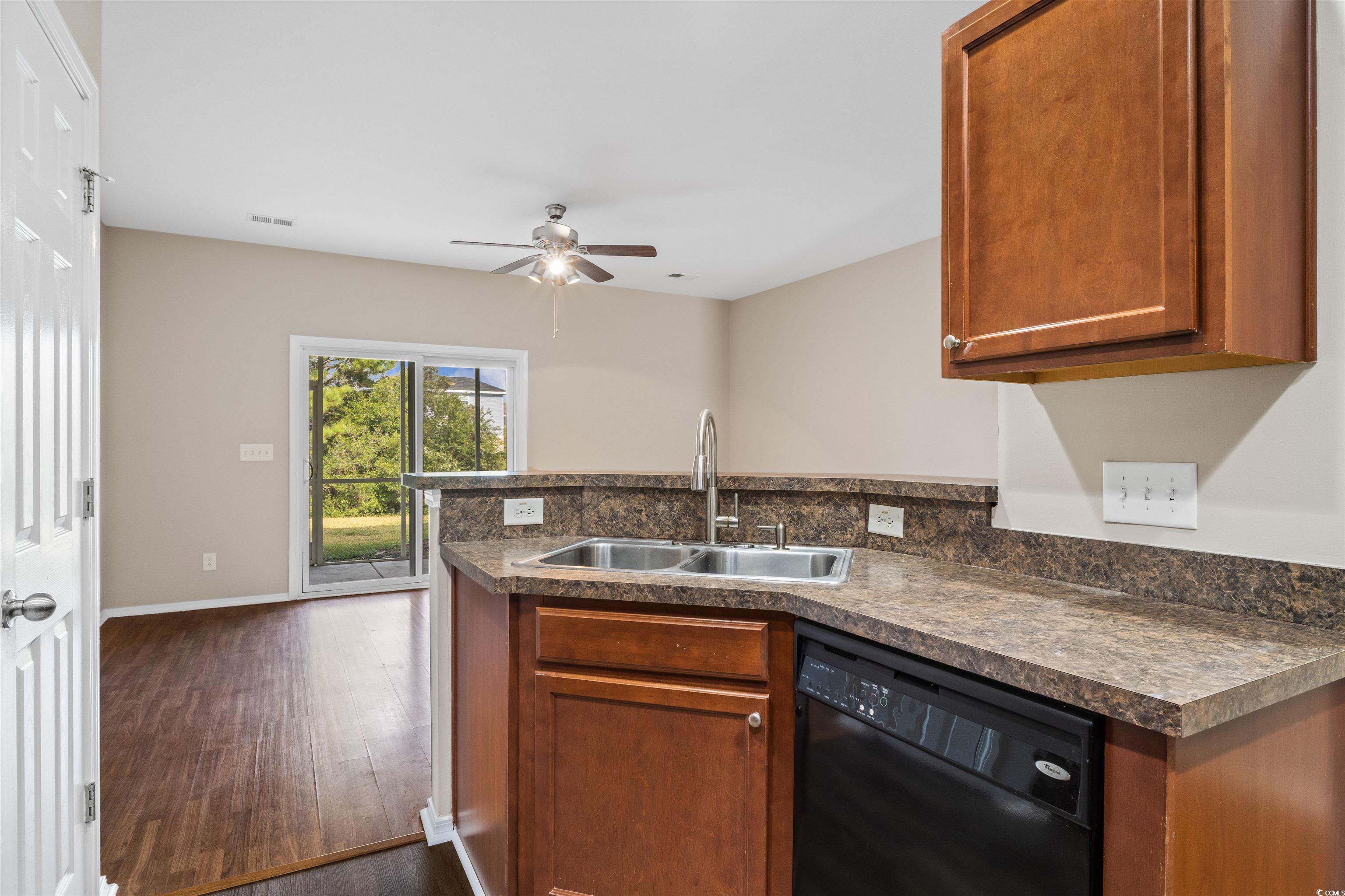 350 Kiskadee Loop, Unit B Conway, SC 29526 - Photo 10 of 40 Kitchen with ceiling fan, kitchen peninsula, sink,