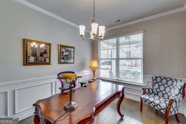 a bathroom with a sink mirror and toilet