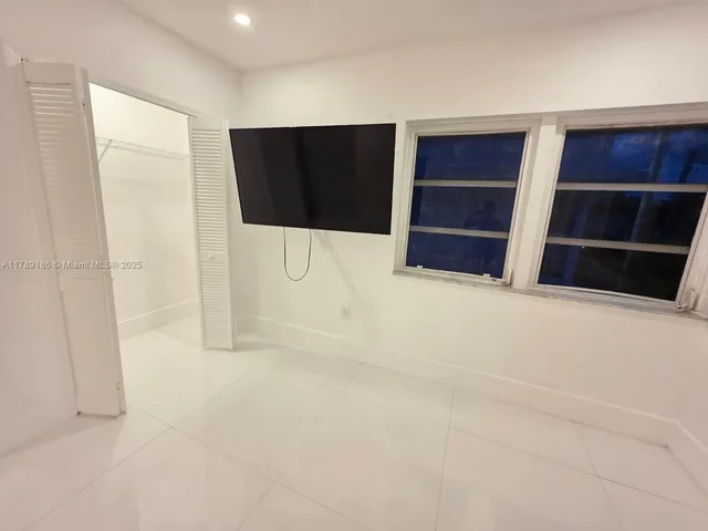 view of bathroom with a toilet and a shower