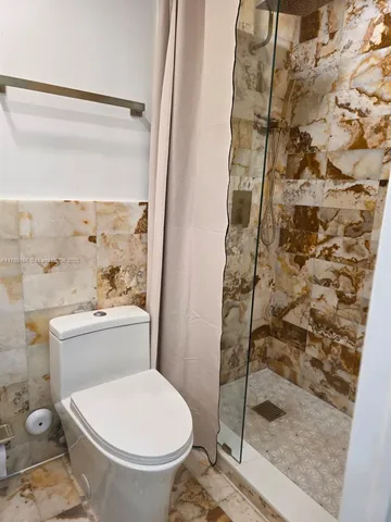 a bathroom with a sink mirror and vanity