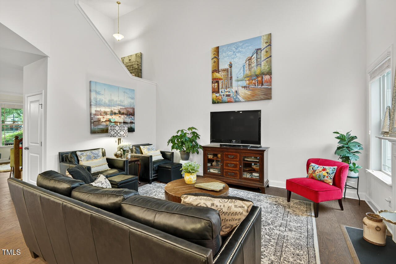 127 Willow View Lane Apex, NC 27539 - Photo 11 of 39 a living room with furniture and a flat screen tv