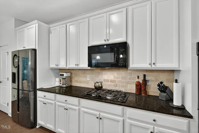 a kitchen that has a lot of cabinets