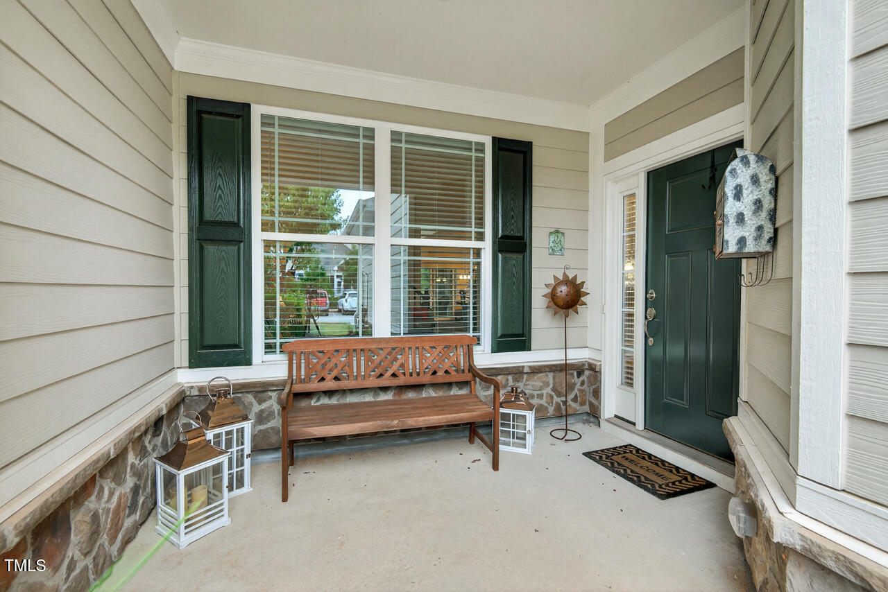 127 Willow View Lane Apex, NC 27539 - Photo 2 of 39 a view of a two chairs in the balcony