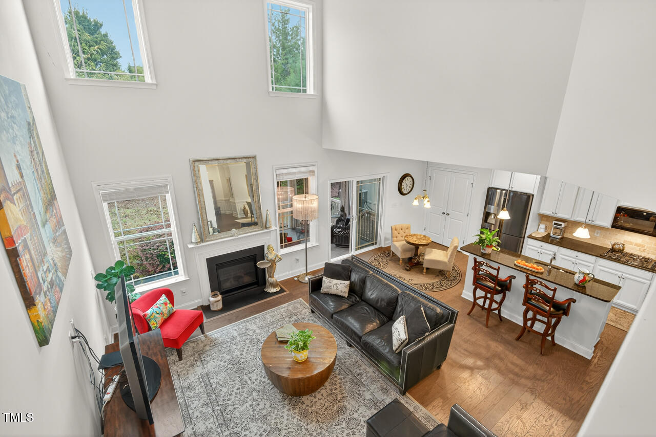127 Willow View Lane Apex, NC 27539 - Photo 20 of 39 a living room with furniture and a fireplace