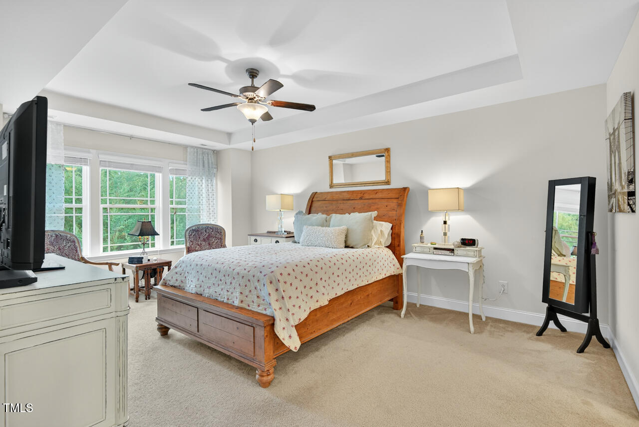 127 Willow View Lane Apex, NC 27539 - Photo 21 of 39 a bedroom with a bed and a desk