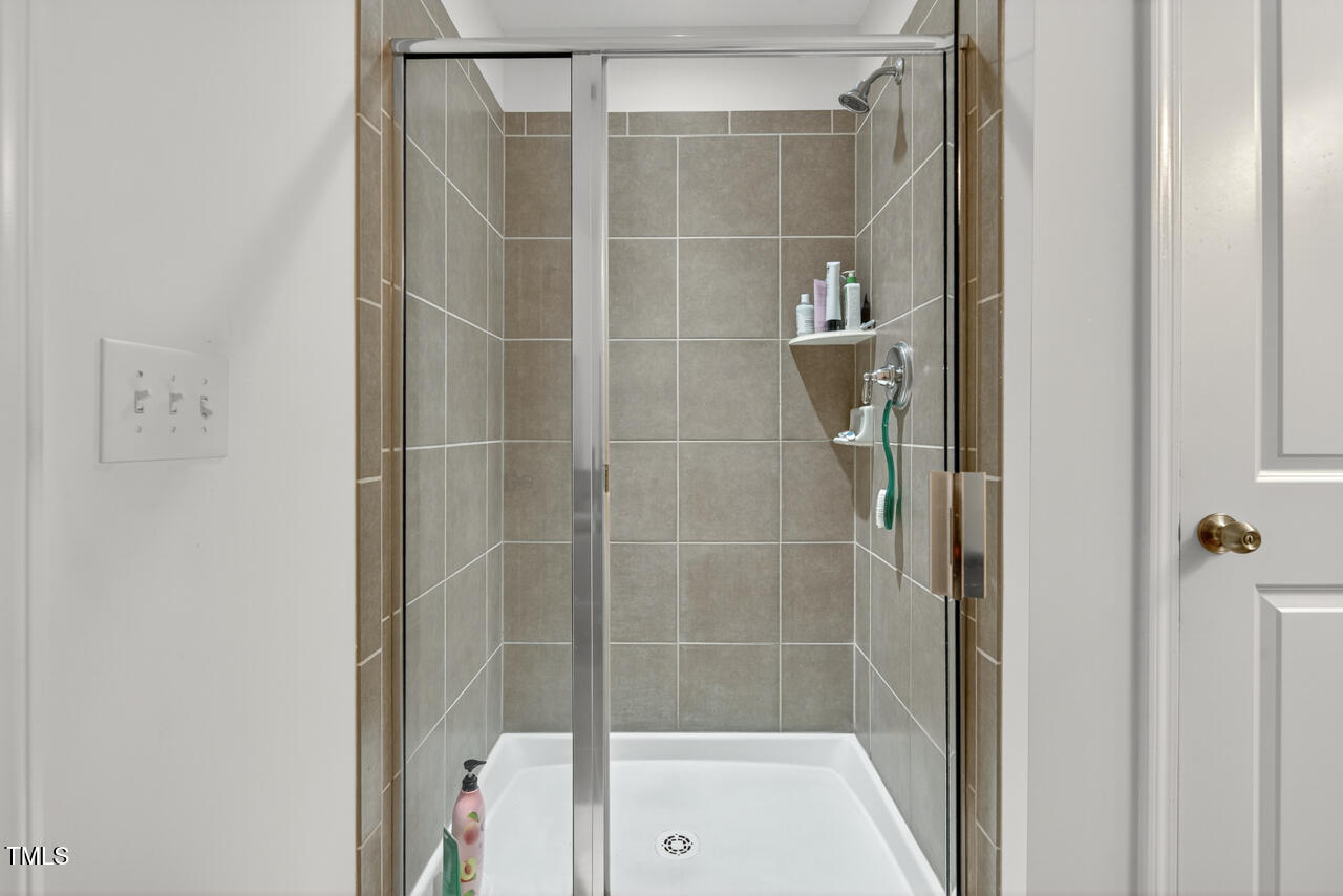 127 Willow View Lane Apex, NC 27539 - Photo 25 of 39 a bathroom with a shower