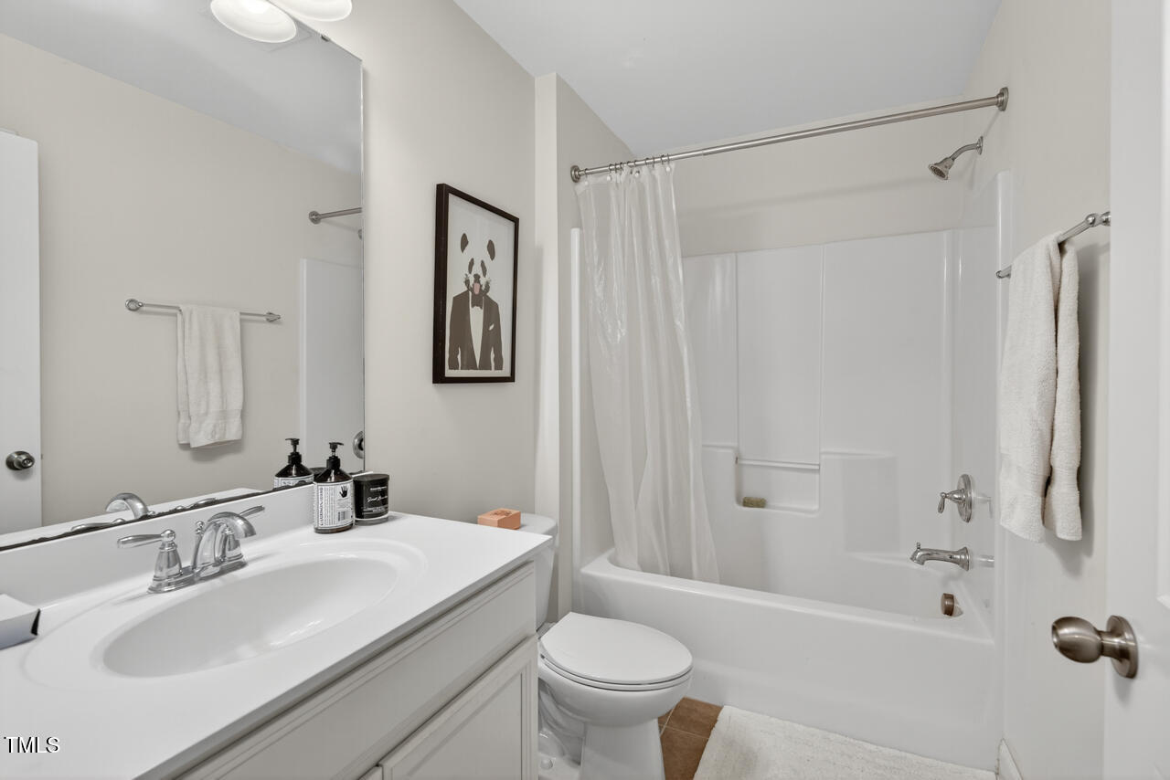 127 Willow View Lane Apex, NC 27539 - Photo 30 of 39 a bathroom with a sink toilet and shower