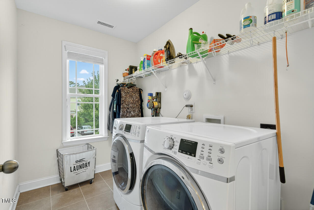 127 Willow View Lane Apex, NC 27539 - Photo 31 of 39 a utility room with dryer and washer