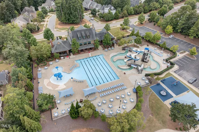 an aerial view of a house with outdoor space