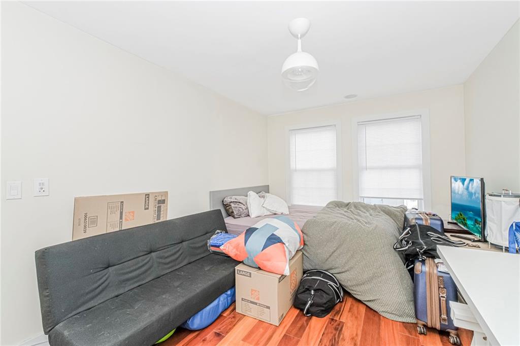 934 Jefferson Avenue Brooklyn, NY 11221 - Photo 14 of 36 a living room with furniture and a table