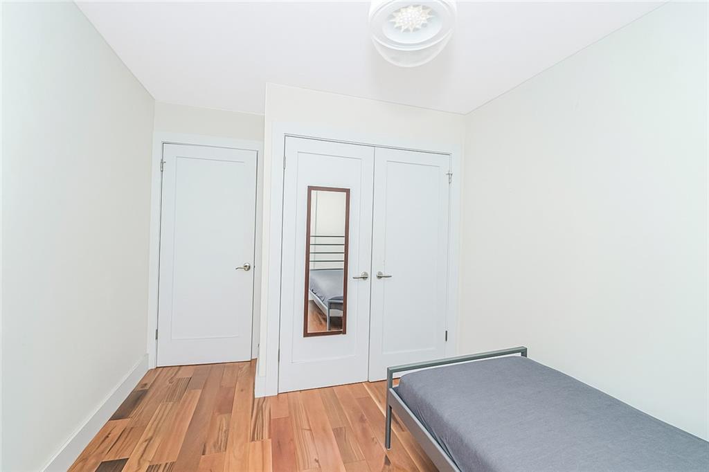 934 Jefferson Avenue Brooklyn, NY 11221 - Photo 15 of 36 a view of a room with wooden floor and bathroom