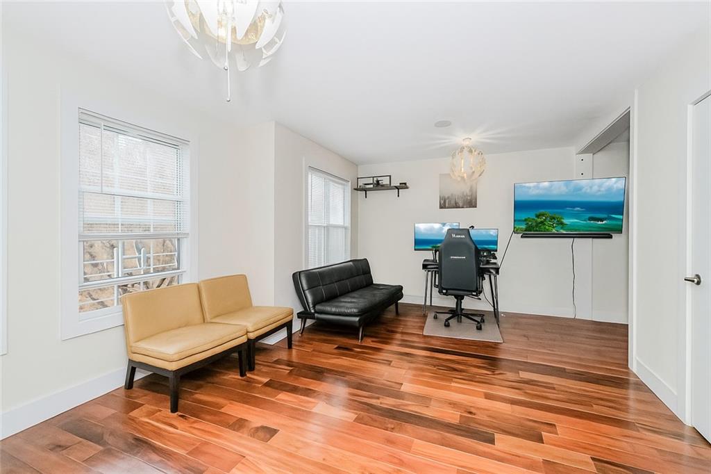 934 Jefferson Avenue Brooklyn, NY 11221 - Photo 17 of 36 a living room with furniture and a wooden floor