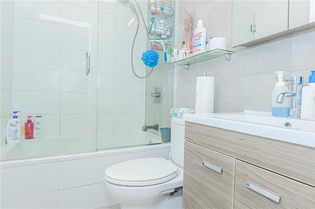 934 Jefferson Avenue Brooklyn, NY 11221 - Photo 24 of 36 a bathroom with a sink a toilet and shower