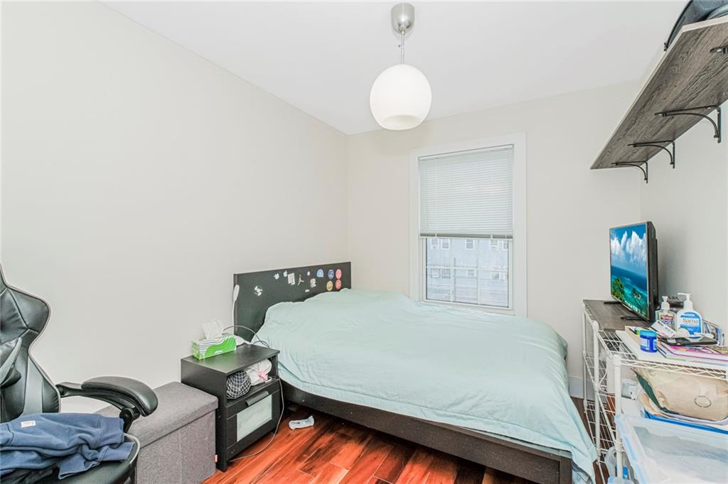 934 Jefferson Avenue Brooklyn, NY 11221 - Photo 27 of 36 a bedroom with a bed and a couch