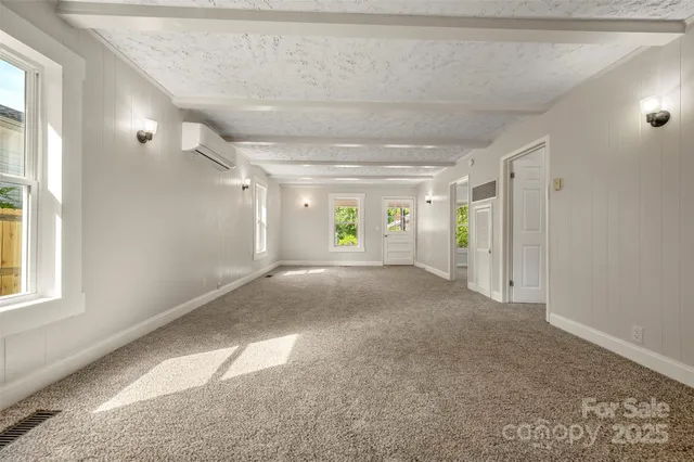 a view of a hallway with wooden shelves