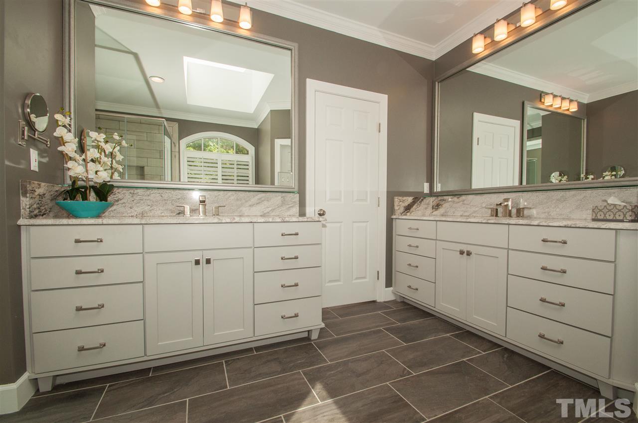 408 Chatterson Drive Raleigh, NC 27615 - Photo 13 of 25 a bathroom with a double vanity sink mirror and