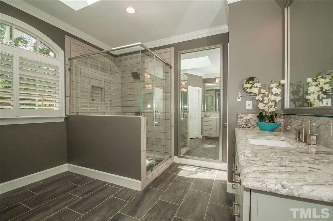 408 Chatterson Drive Raleigh, NC 27615 - Photo 14 of 25 a bathroom with a shower and a sink