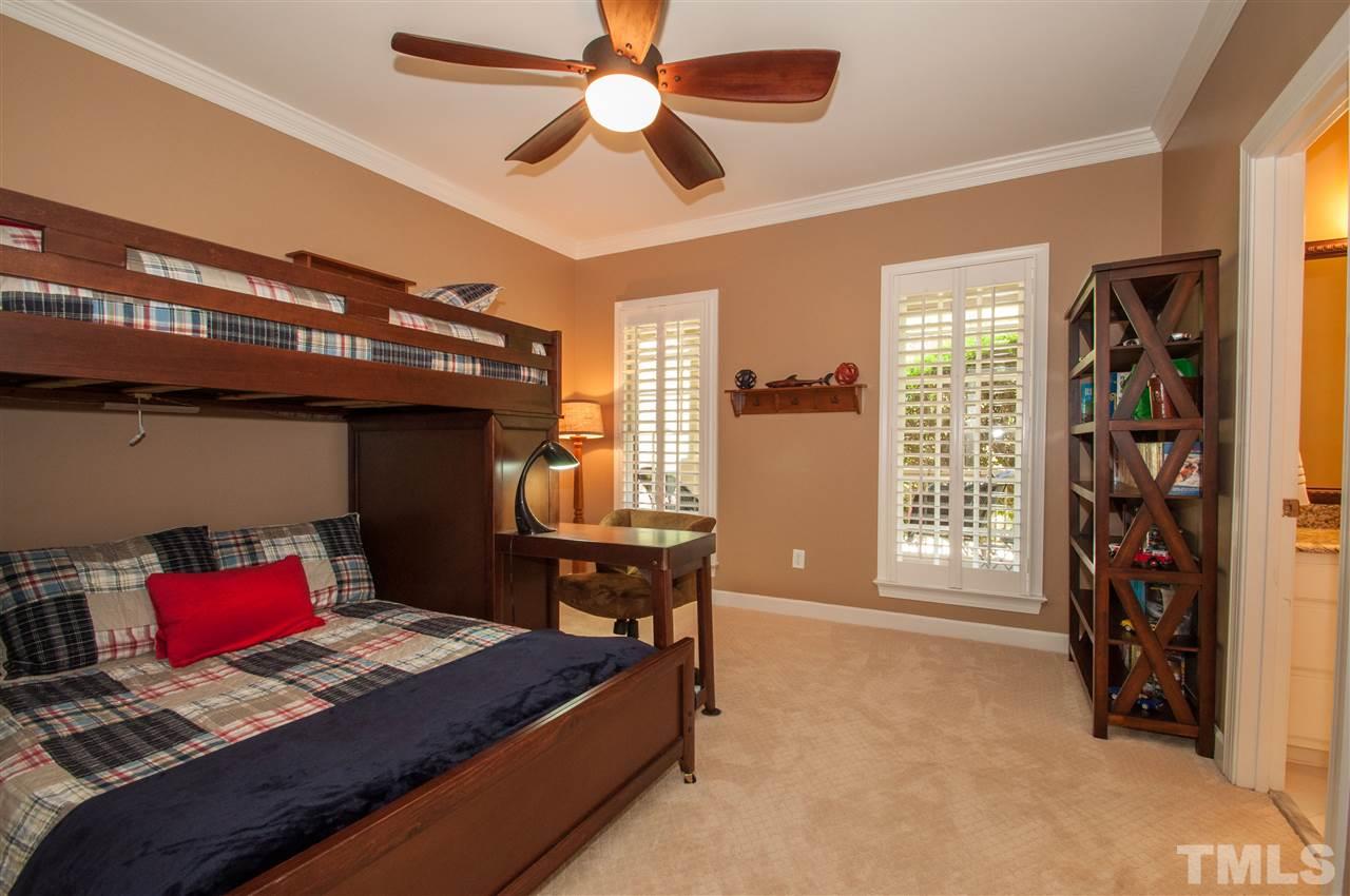 408 Chatterson Drive Raleigh, NC 27615 - Photo 15 of 25 a bedroom with a bed and a window