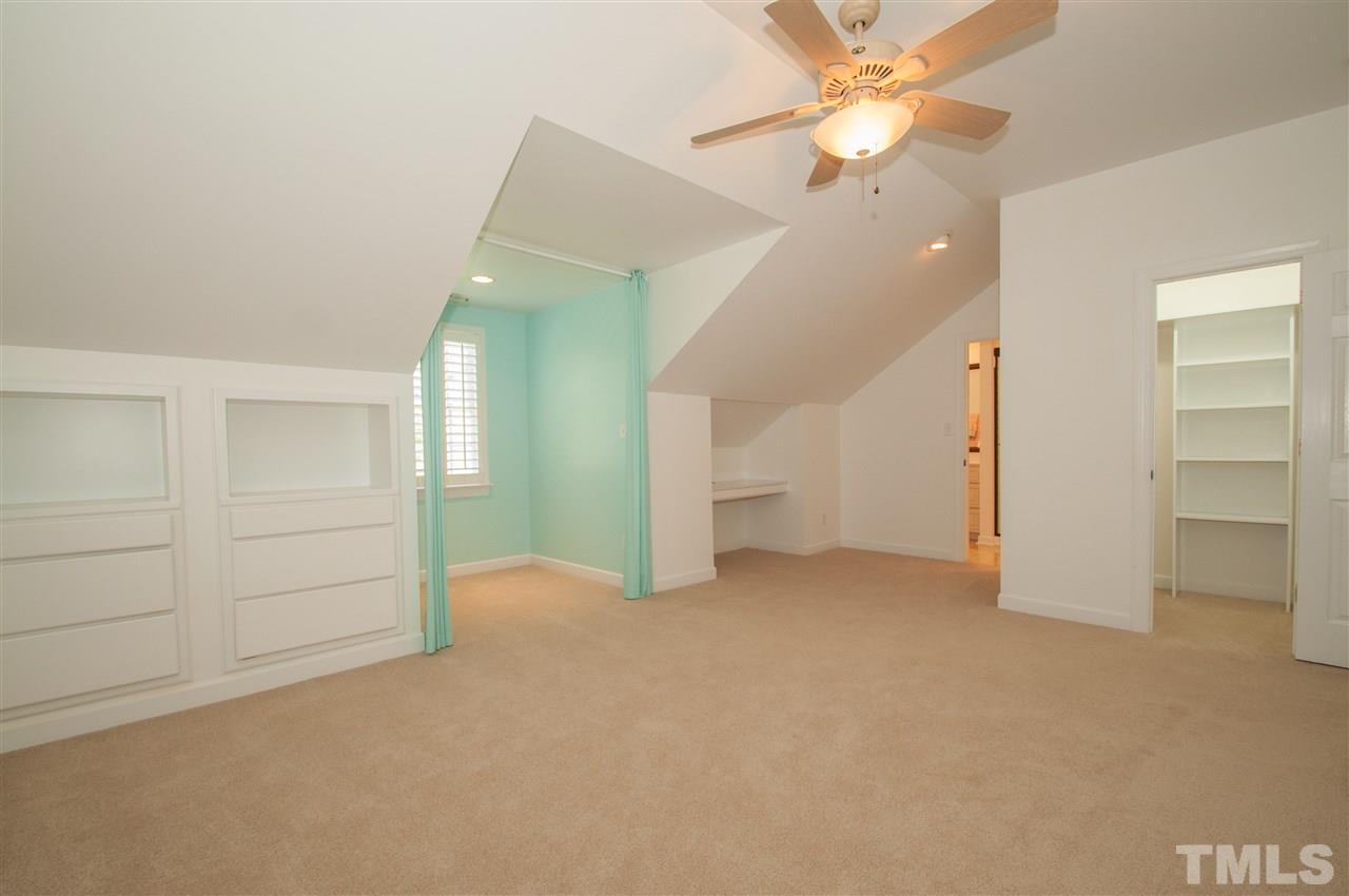 408 Chatterson Drive Raleigh, NC 27615 - Photo 16 of 25 an empty room with closet and a ceiling fan