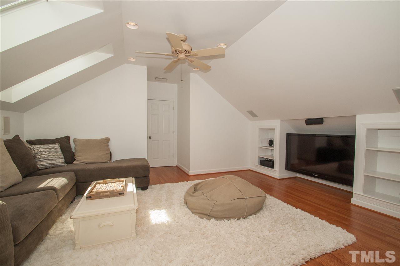 408 Chatterson Drive Raleigh, NC 27615 - Photo 18 of 25 a living room with furniture and a fireplace