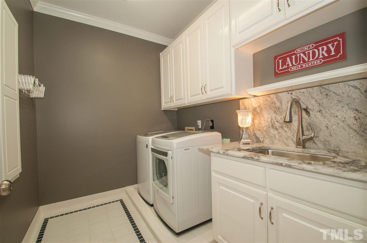 408 Chatterson Drive Raleigh, NC 27615 - Photo 19 of 25 a utility room with dryer and washer
