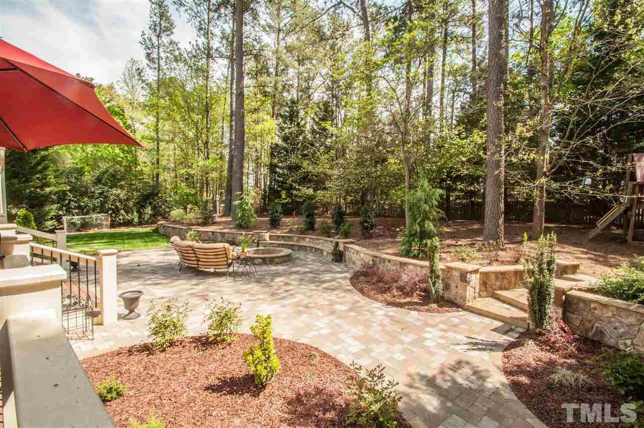 408 Chatterson Drive Raleigh, NC 27615 - Photo 23 of 25 a view of a swimming pool with a patio