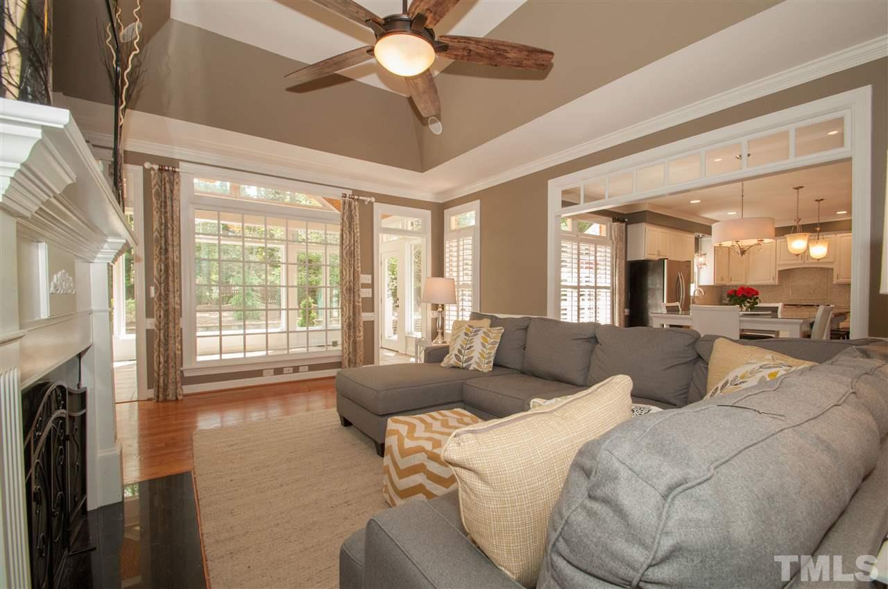 408 Chatterson Drive Raleigh, NC 27615 - Photo 8 of 25 a living room with furniture and a fireplace