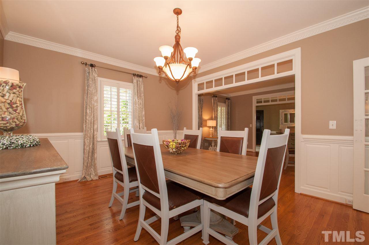 408 Chatterson Drive Raleigh, NC 27615 - Photo 9 of 25 a view of a dining room with furniture window and wooden floor