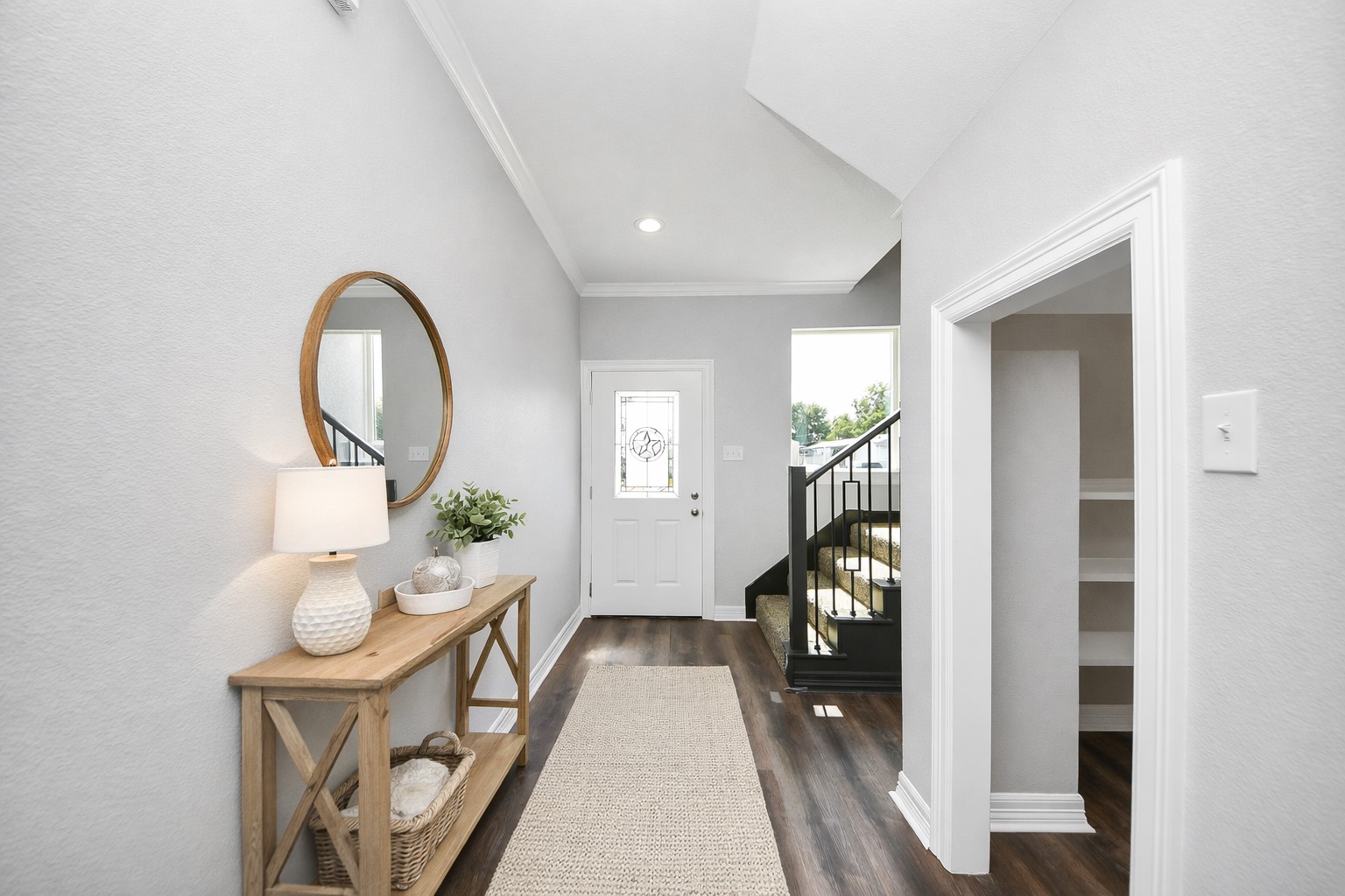 414 North 4th Street Beasley, TX 77417 - Photo 13 of 26 Another look at the bright and inviting foyer, featuring an impressive under-stairs niche that adds both charm and practical storage. This thoughtful detail blends style and function, making a great first impression the moment you enter - virtually staged.